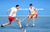 Iga Swiatek and Hubert Hurkacz in their mixed doubles match against Camilla Rosatello and Lorenzo Musetti